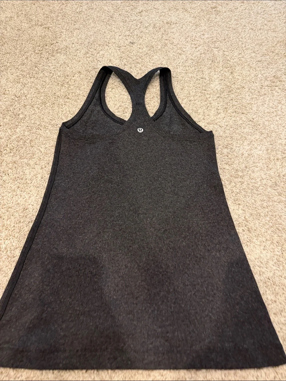 Lululemon size 6 Racerback Tank Top. Dark gray Worn once looks/feels brand new.